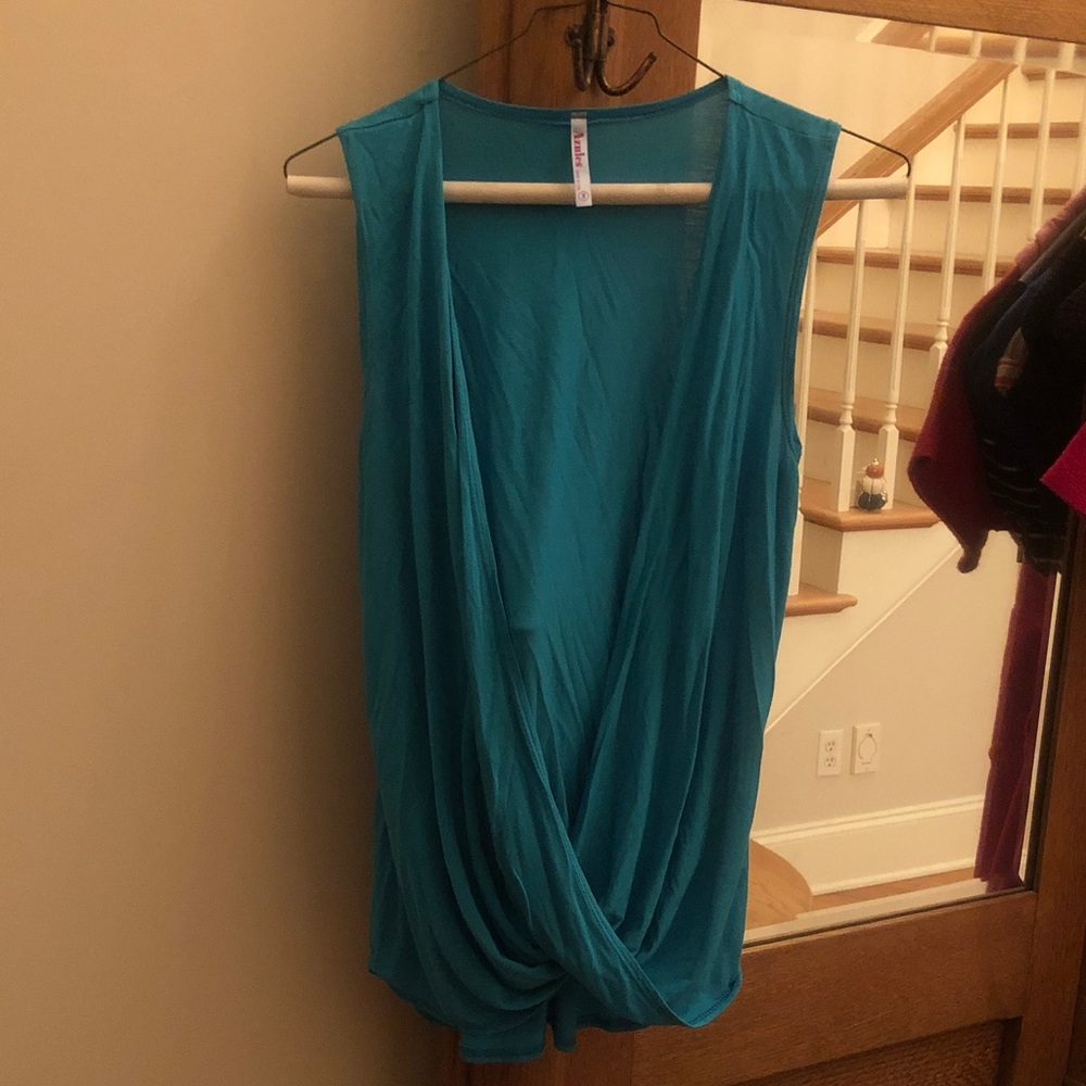 Azules Turquoise Tank Top with Sleek Design size small, soft and comfortable